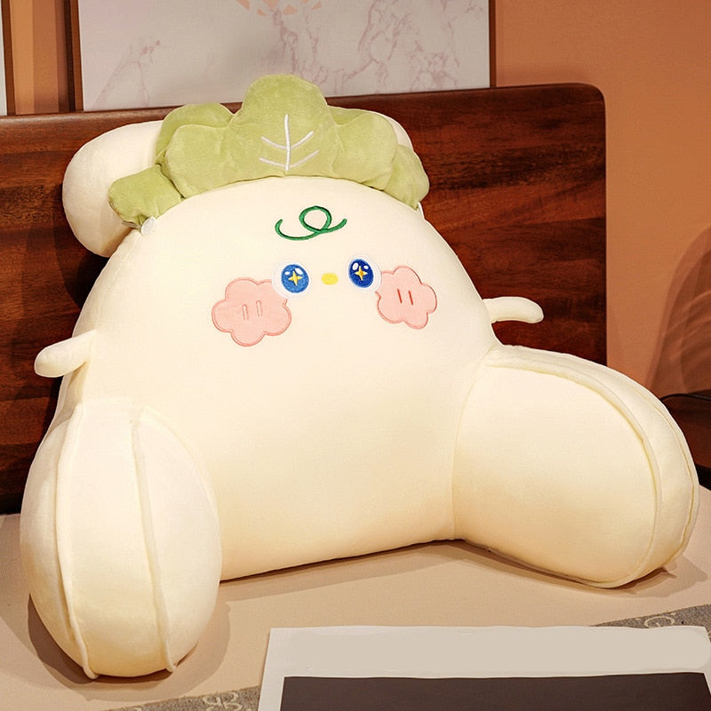 Cabbage-shaped reading pillow with cream body, green leaf hood, neutral face