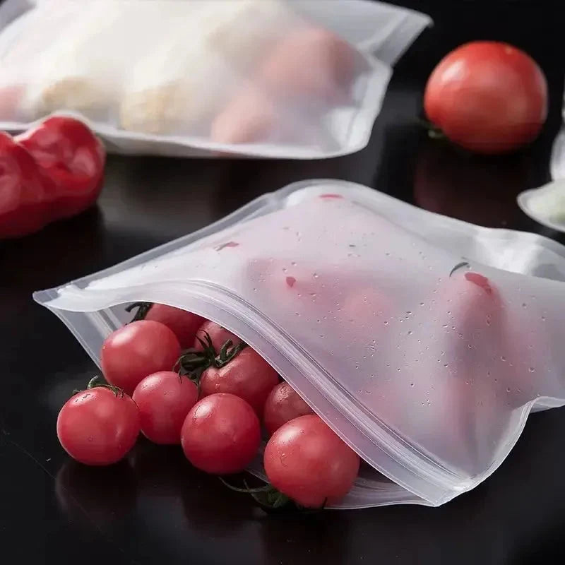 Clear zip-top silicone storage bag filled with red tomatoes