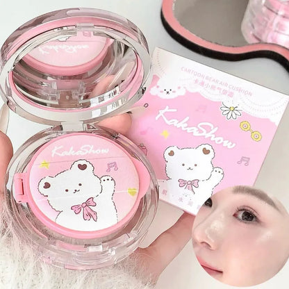 Open air cushion foundation compact with pink cushion insert and clear lid, plus product box