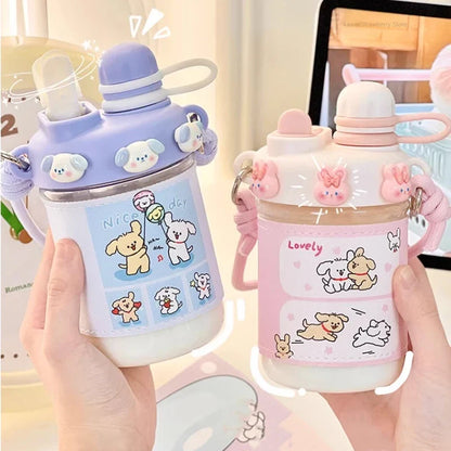 Blue and pink animal-themed water bottles with straw lids and loop carry straps