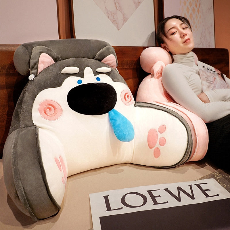 Gray animal reading pillow with cartoon dog face, blue nose, and swirl cheek details