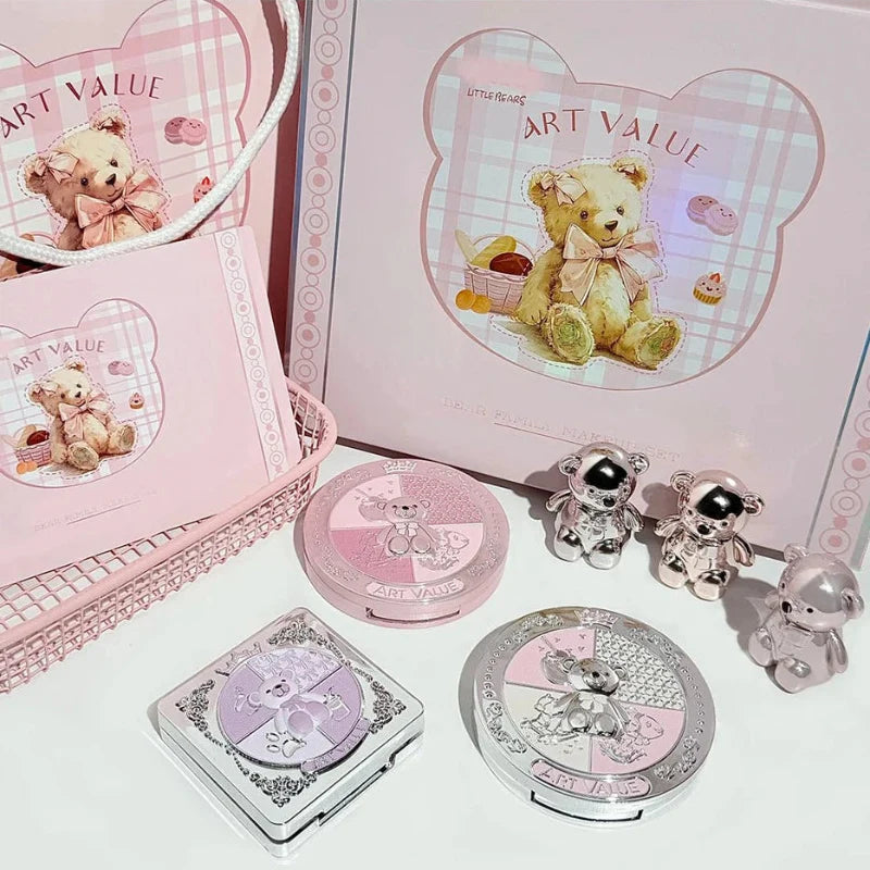 Bear-themed makeup compacts and eyeshadow palette arranged in gift packaging