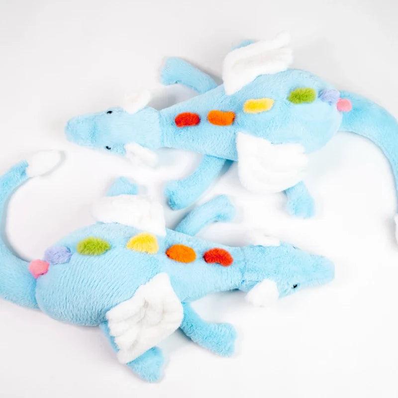 Rainbow dragon plush toy stack view, light blue body with white clouds and multicolor spots