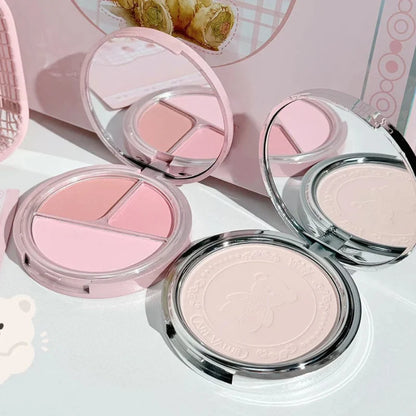 Set of pink-toned blush compacts with two round pans and one open compact