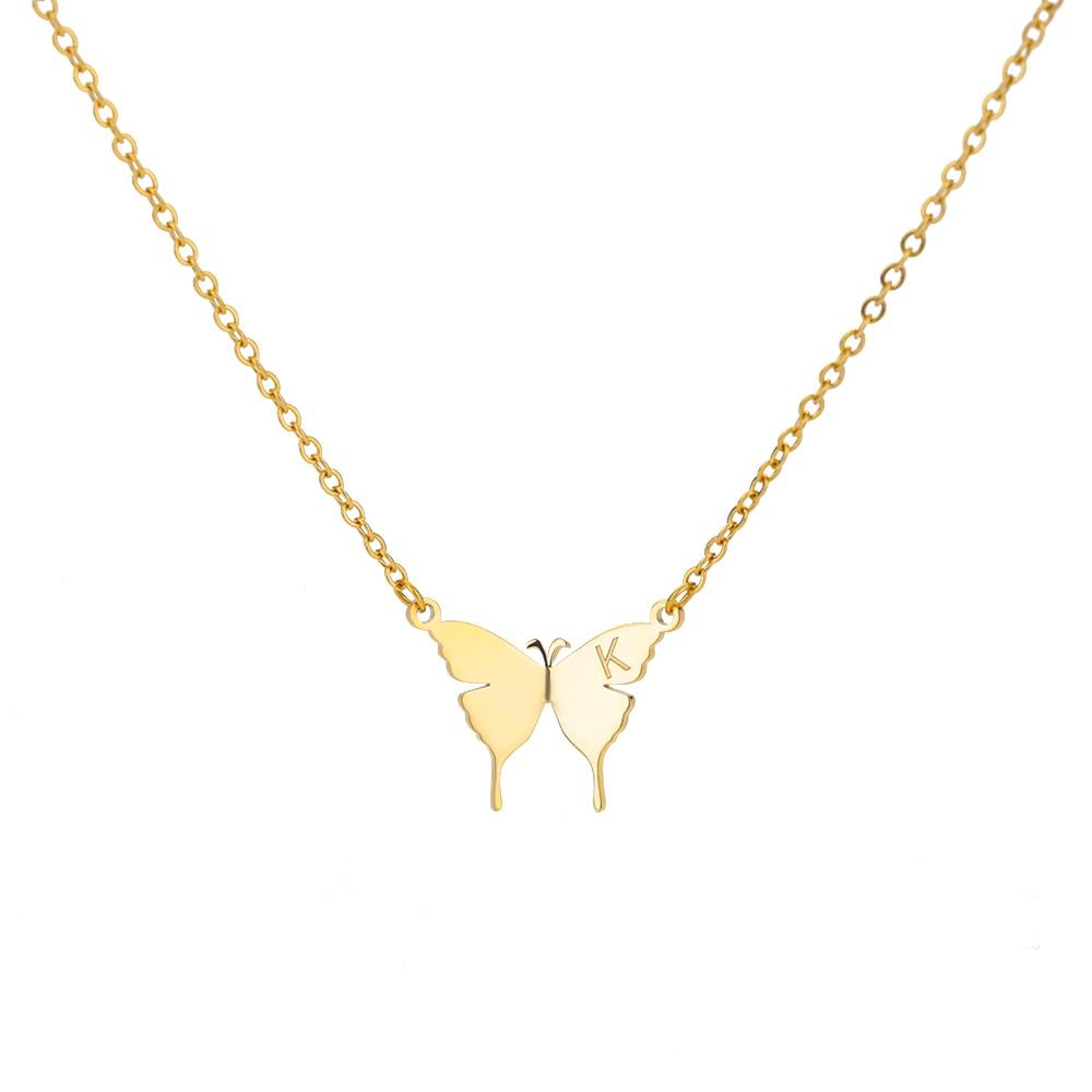 Gold-tone butterfly initial letter necklace with letter K between two butterfly pendants