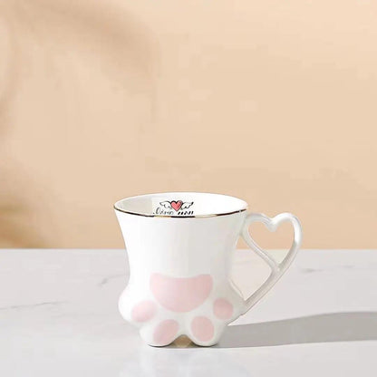 White cat paw mug with heart-shaped handle and pink paw pad accents
