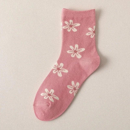 Pink socks with white flower and petal prints