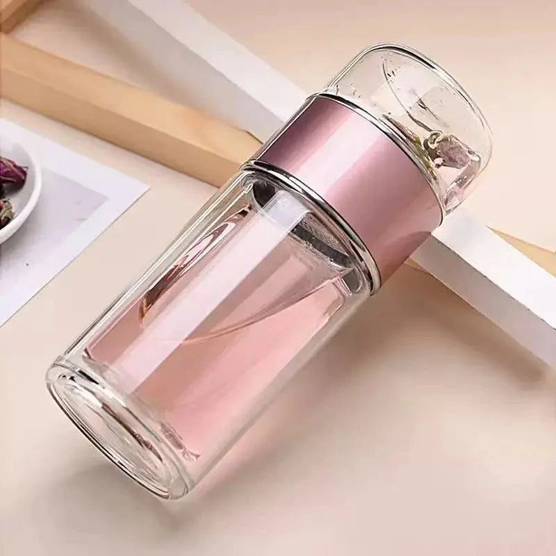 Transparent storage bottle with pinkish metal band and clear top, tilted