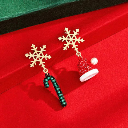 Drop earrings with gold snowflake tops, teal beaded candy-cane dangles, and red bell charm
