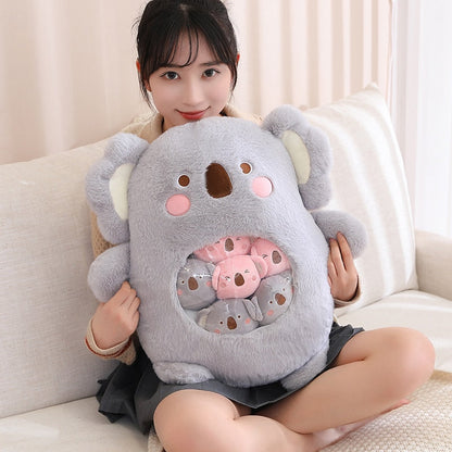 Plush animal shaped pillow in light grey, koala face design with inner pastel graphic