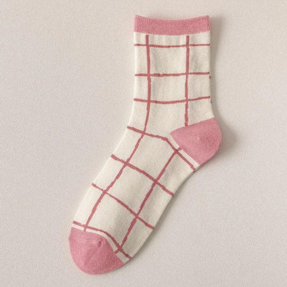 White socks with pink plaid grid pattern and pink heel and toe