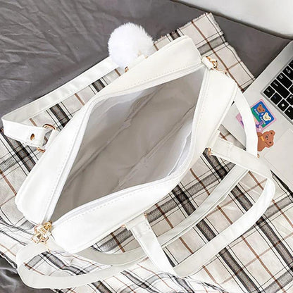 White messenger bag with plaid lining, faux-fur trim, and zipper front pocket