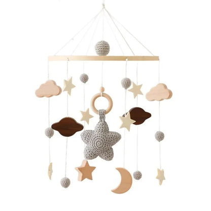 Baby crib mobile with hanging star, cloud, moon, and woven character ornaments