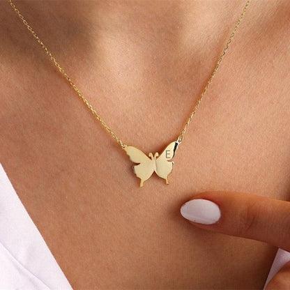 Butterfly pendant necklace with letter E, gold-tone chain