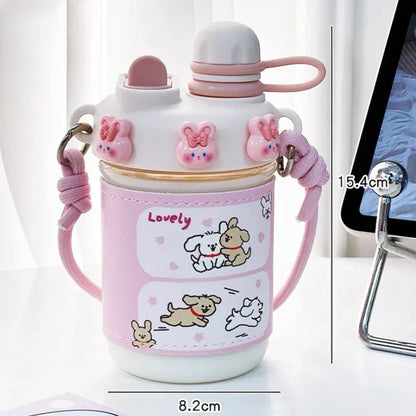 Pink kids water bottle with straw lid and carry strap, cute animal faces and hearts print