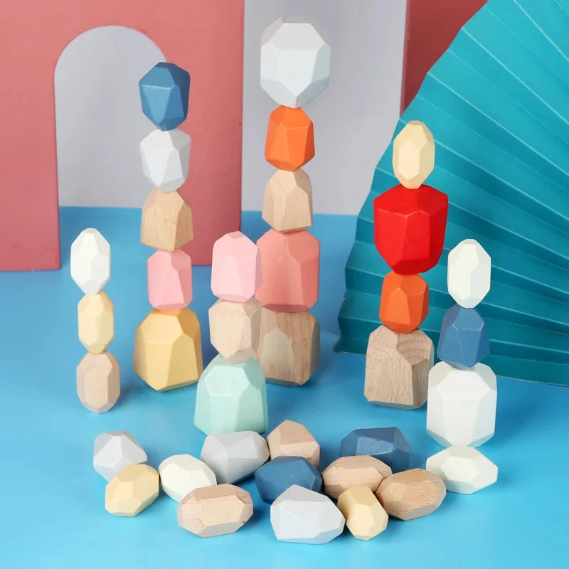 Wooden stacking rocks toy with multicolor stacks on a blue surface
