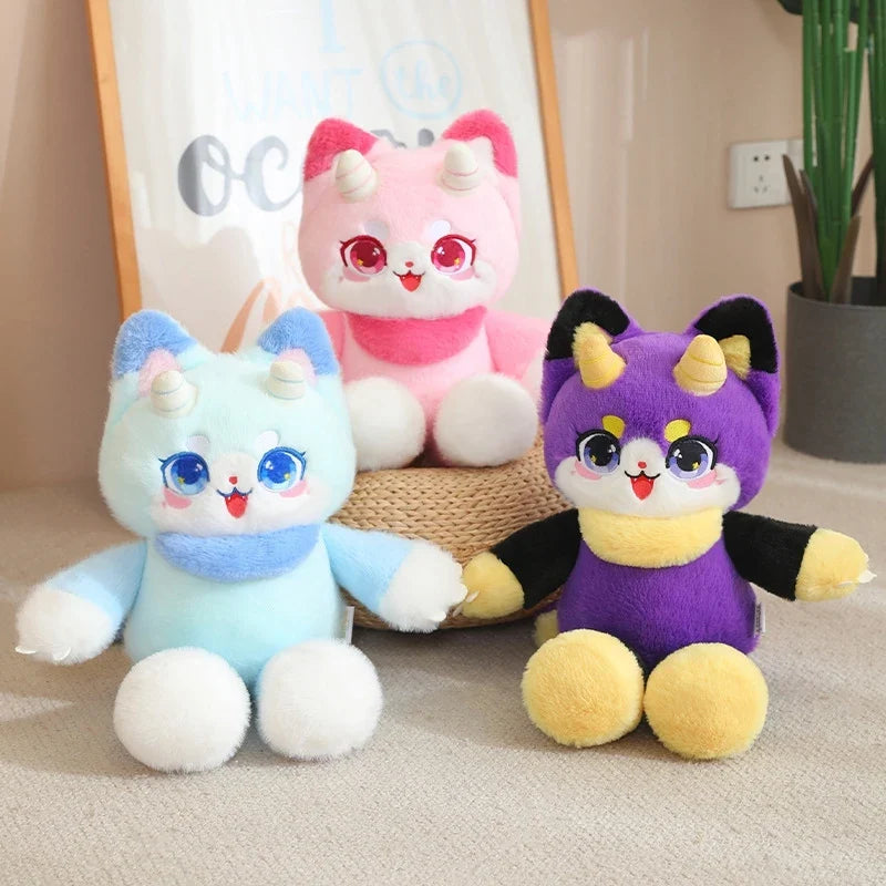 Set of three dragon cat plush toys: pink, light blue, and purple, with big cartoon eyes