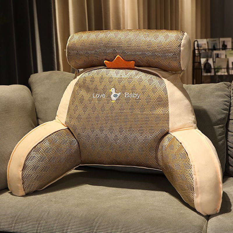 Textured plush reading pillow with wraparound arms and cream-and-brown animal face