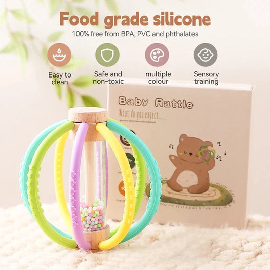 Baby rattle teether toy with multicolor silicone rings and bead-filled center