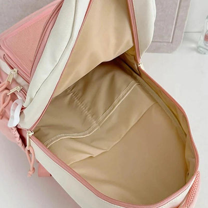 Pink mini cat-ear backpack open to reveal beige main compartment interior