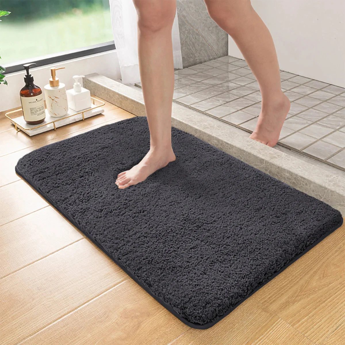 Dark gray long-pile absorbent bathroom mat with non-slip backing, rectangular design