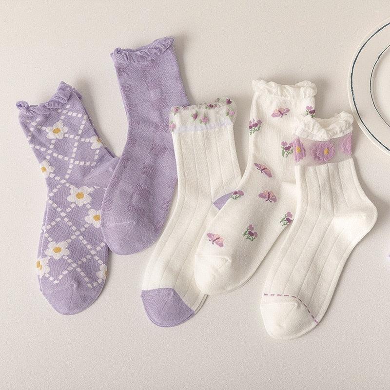 Floral socks set: lavender argyle, lavender solid, and white socks with small flowers