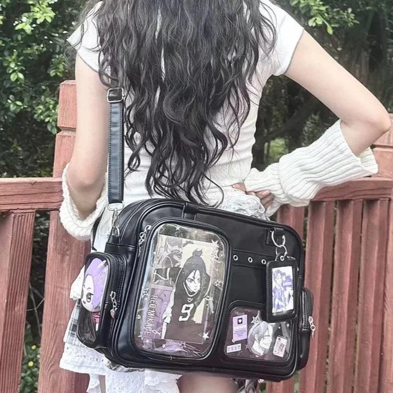 Pastel crossbody bag, black, front clear window pouch with character prints and charms