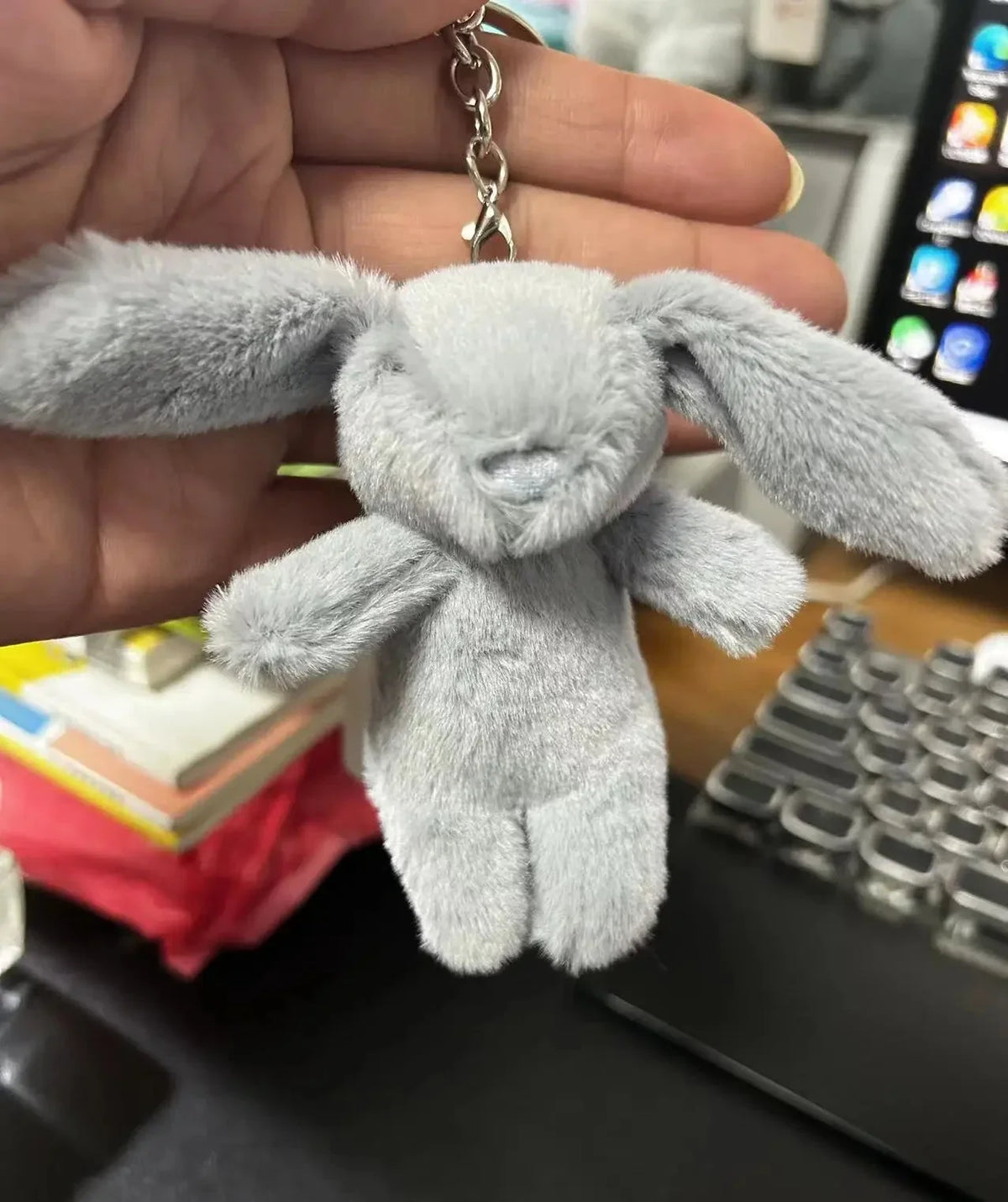 Light gray rabbit plush keychain with silver chain and metal ring