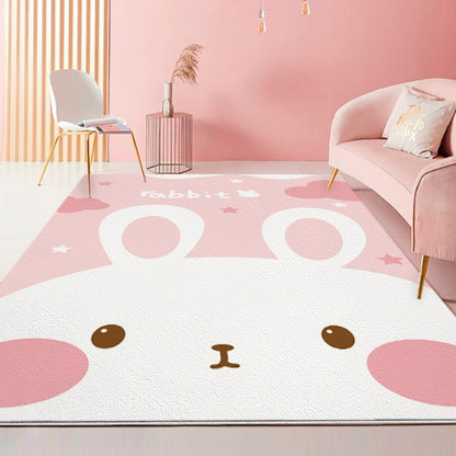 Pink and white rabbit area rug with large paw prints and bunny face details