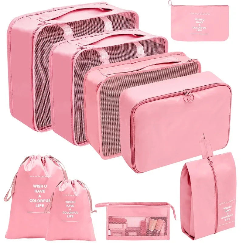 Pink packing cube organizers with gray mesh panels and multiple zip pouches