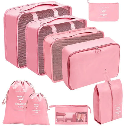 Pink packing cube organizers with gray mesh panels and multiple zip pouches