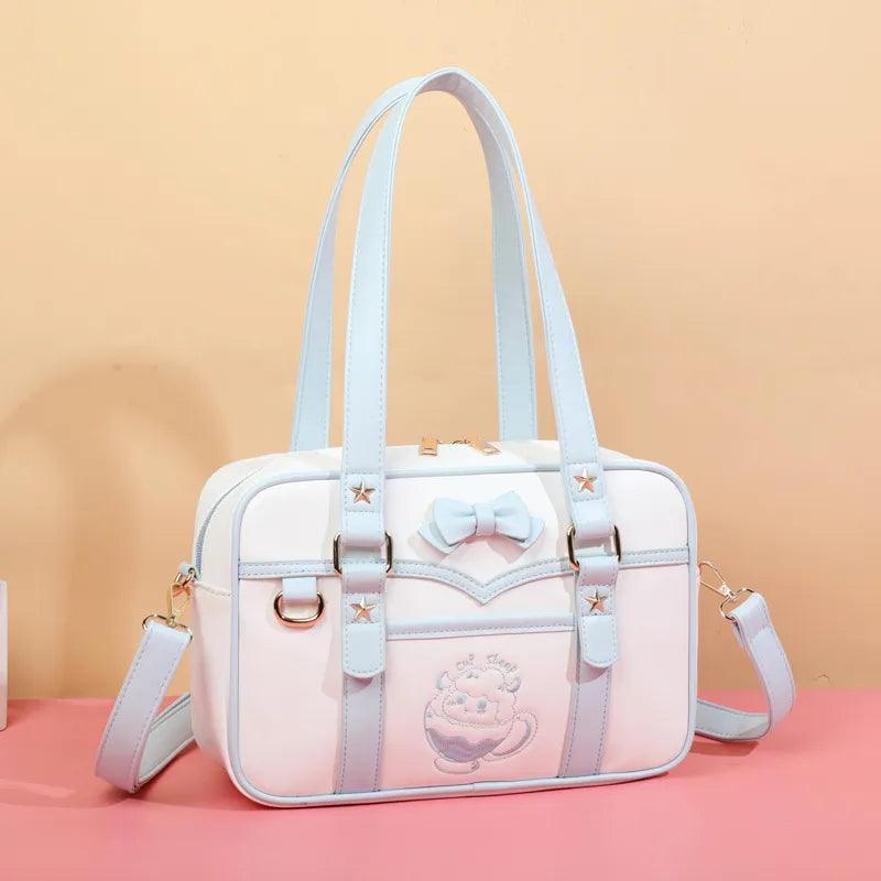Light blue-and-white kawaii messenger bag with bow front, star accents, and side strap