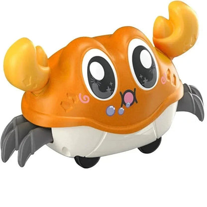 Orange interactive crawling crab toy with cartoon eyes and dark flippers