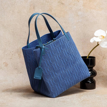 Large knitted tote bag with embossed CHCH pattern, blue shade, dual top handles.