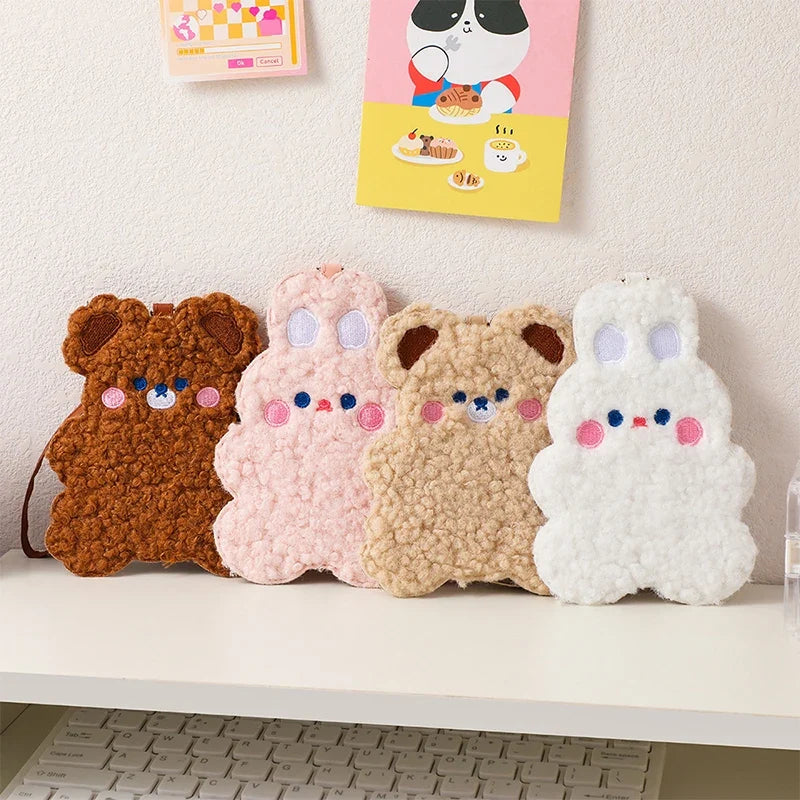 Four plush animal photo card sleeves lined up: brown, pink, beige, and white