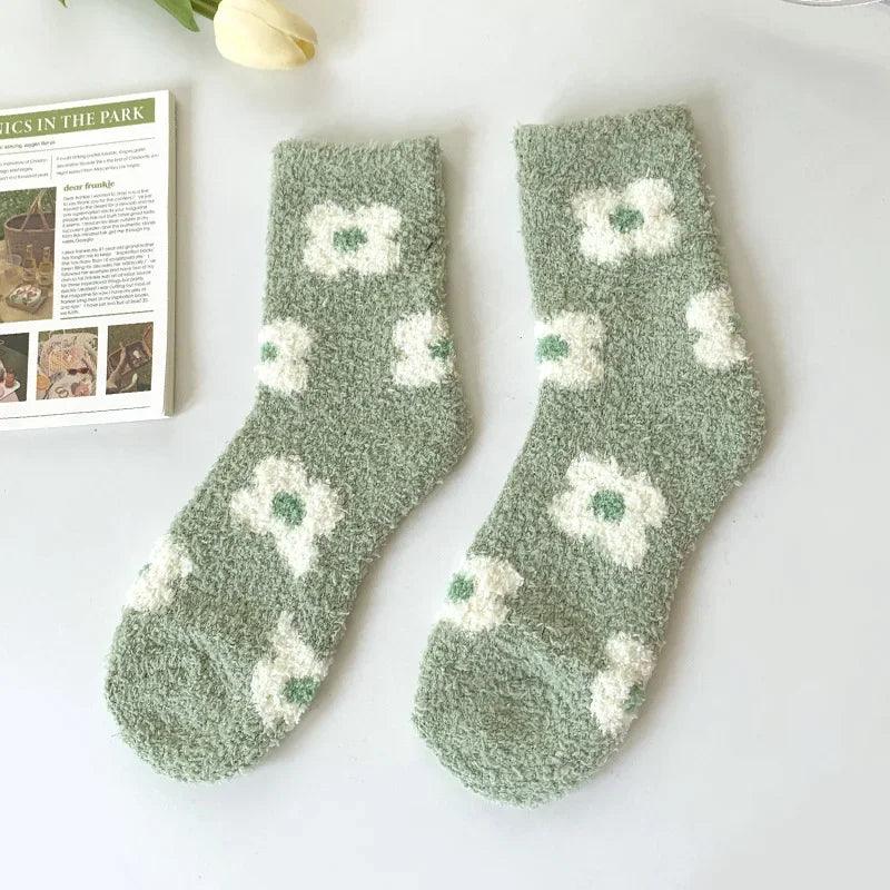 Soft plush sleeping socks, sage green with white flower-like and leaf motifs