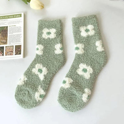 Soft plush sleeping socks, sage green with white flower-like and leaf motifs