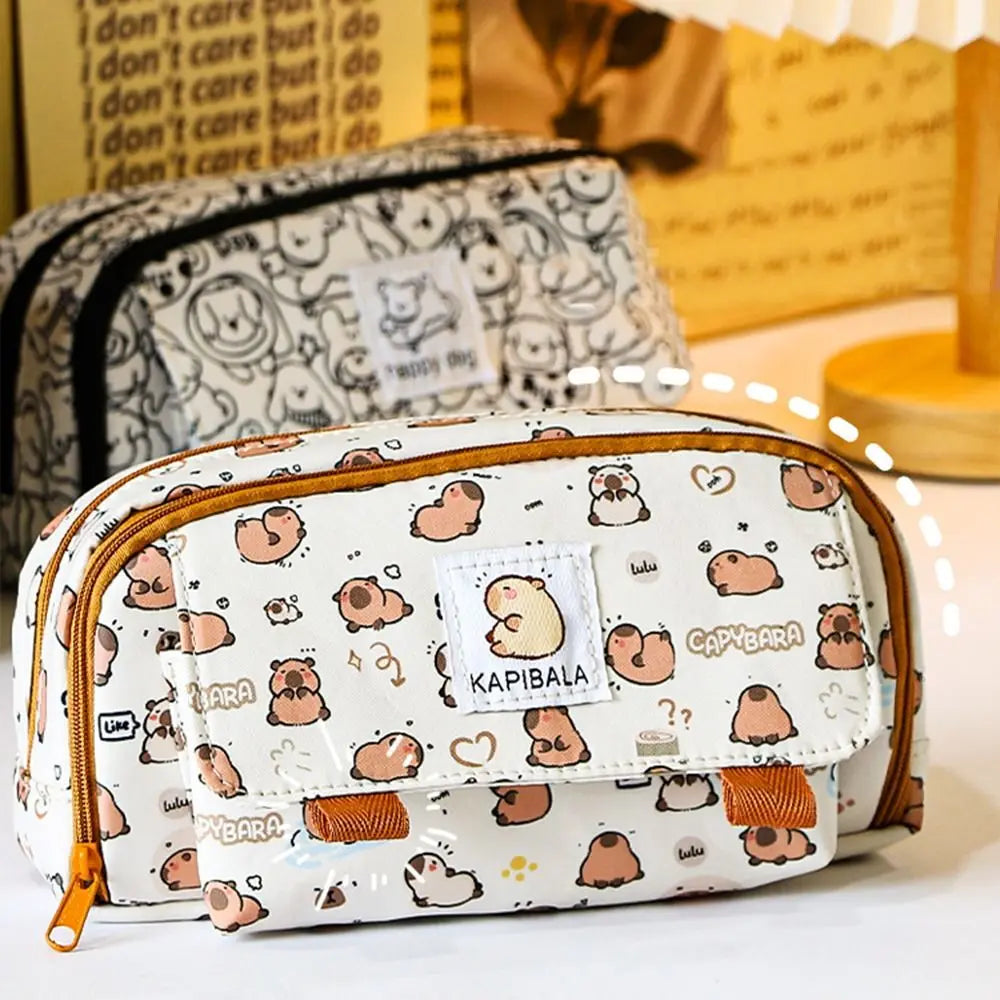 Front view of capybara print pencil bag with centered patch label and orange accents