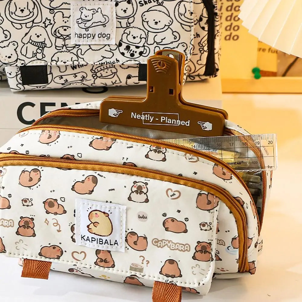 Capybara print pencil bag with front flap pocket and zipper opening, on desk