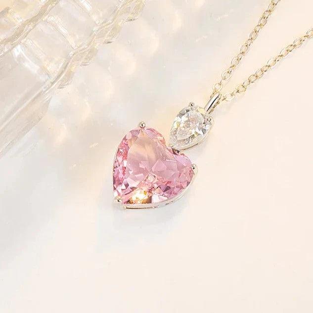 Heart pendant necklace with pink and clear heart stones, linked on a chain