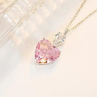 Heart pendant necklace with pink and clear heart stones, linked on a chain