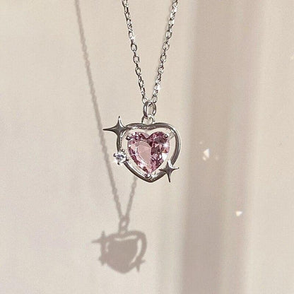 Heart crystal pendant necklace with silver-tone chain and pink faceted heart charm