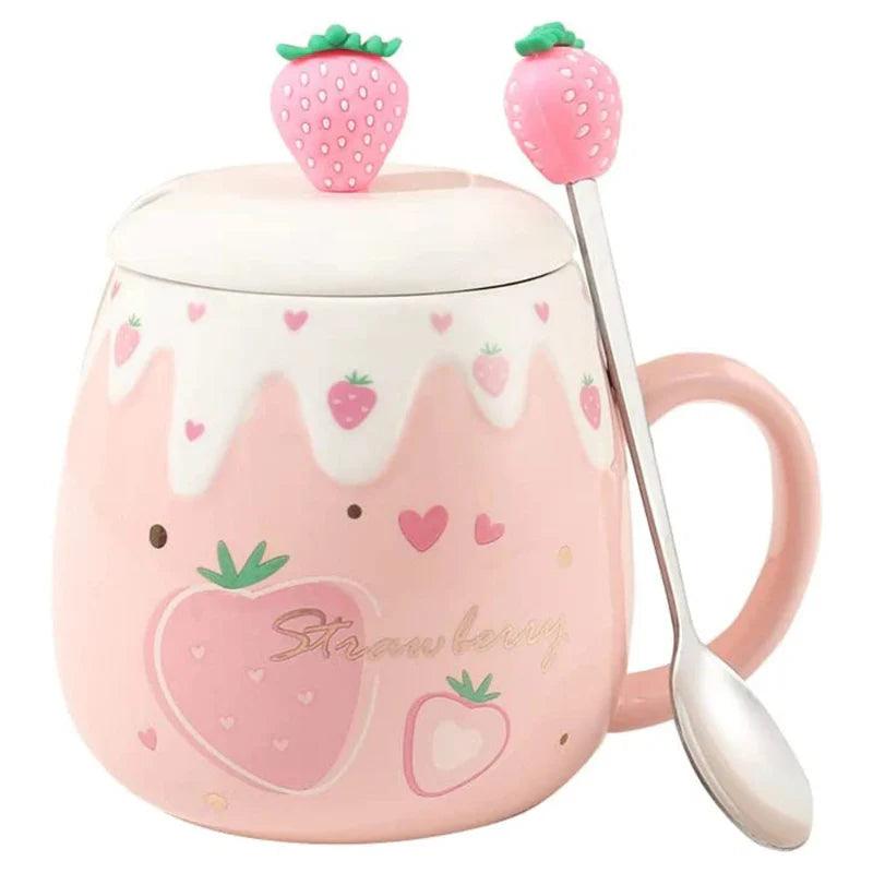 Pink ceramic mug with white lid and strawberry topper; spoon attached; strawberry heart print
