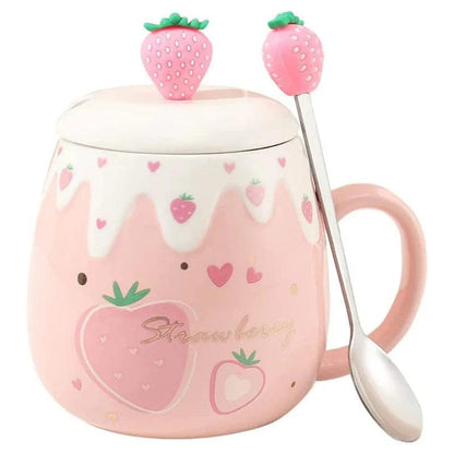 Pink ceramic mug with white lid and strawberry topper; spoon attached; strawberry heart print