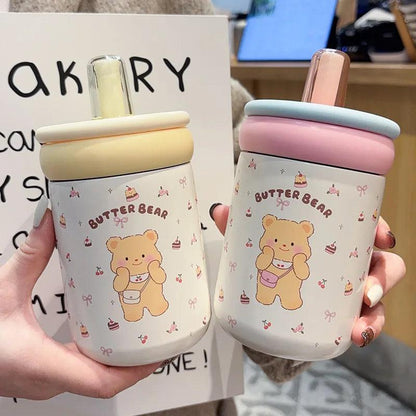 Two Butter Bear thermos cups, cream and pink lids, white bear prints