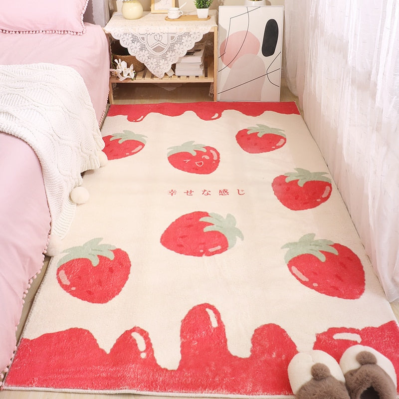 Ivory strawberry pattern area rug with scattered red fruit icons