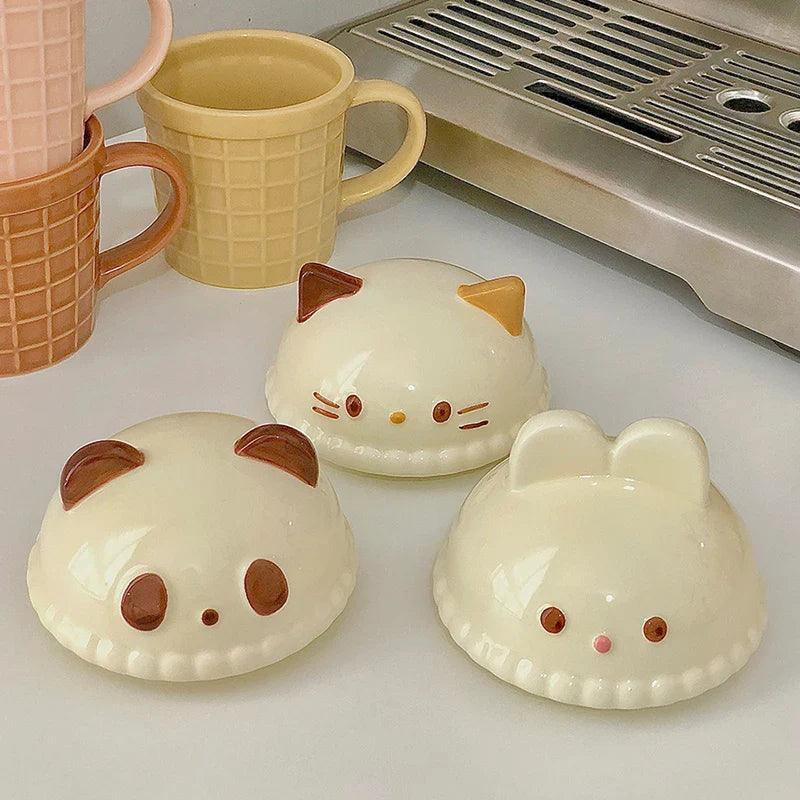 Animal ice cream mug set with cat, panda, and bunny faces in cream and yellow colors