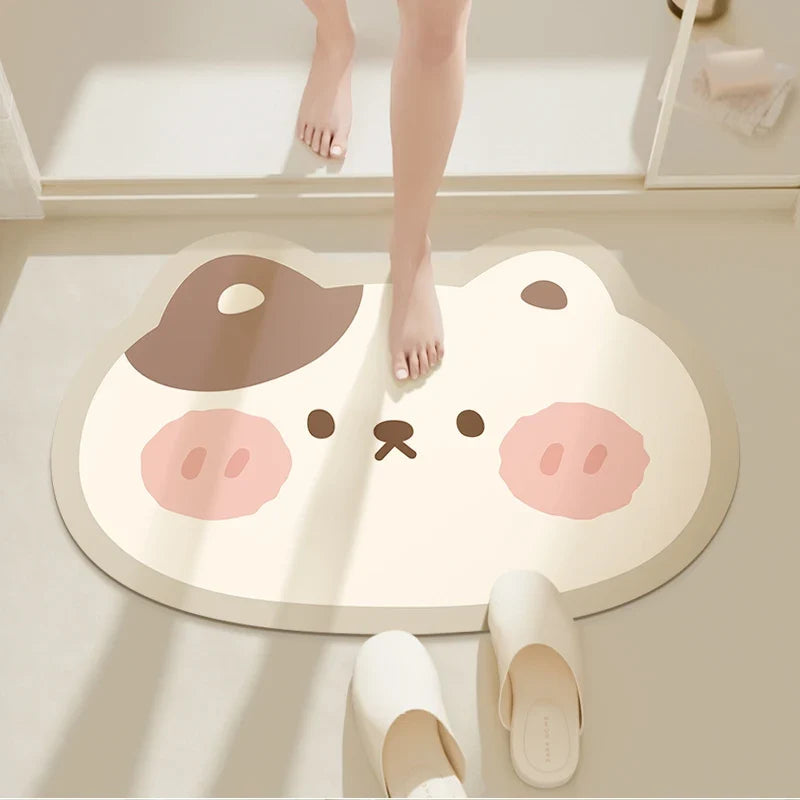 Round bathroom floor mat with cute bear face in brown and cream tones