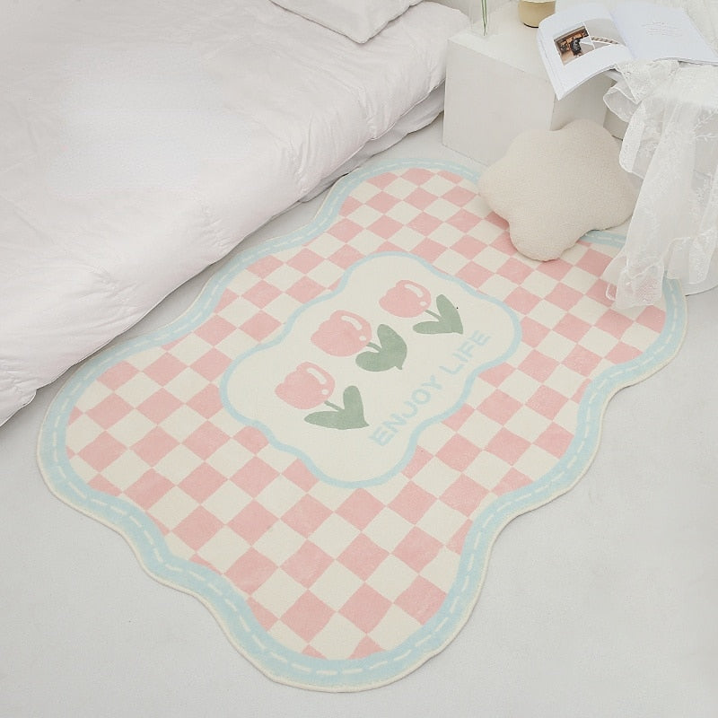 Pink gingham tulip area rug with blue border and scalloped edges