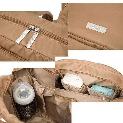 Tan diaper bag backpack interior with zip pockets and bottle holder sleeve